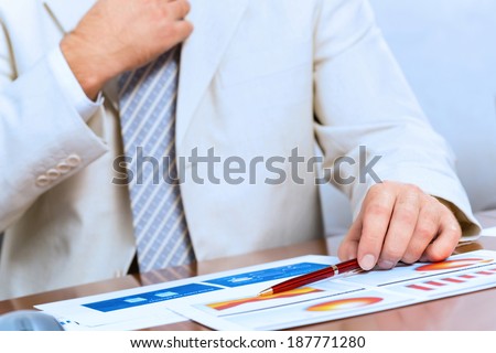 image of businessman without face straightens tie yourself