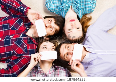 four young men lie together, applied to the face blank card