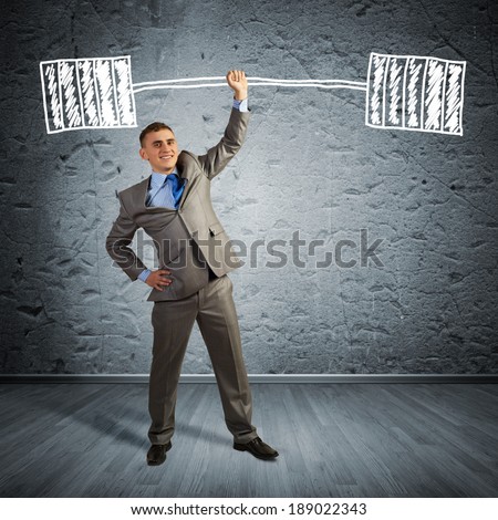 businessman holding a hand sketched barbell, concept achievements in business