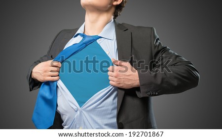 businessman tearing his shirt under her blue clothes super hero