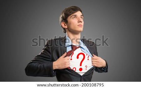 businessman breaks the shirt, under which the question marks