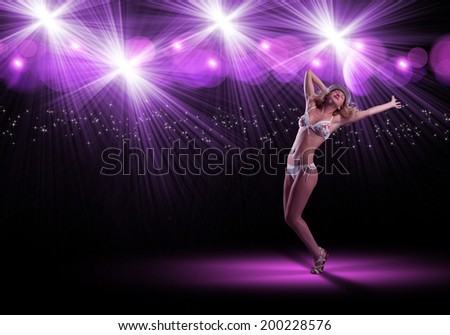 image of young woman in bikini and hat dancing, isolated on black background