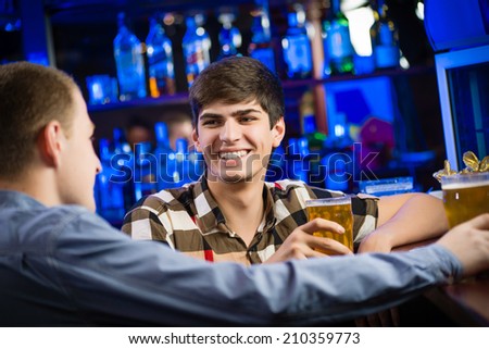 portrait of a young man at the bar, fun nightlife