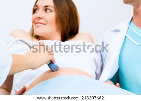 hands and abdominal ultrasound scanner for pregnant women