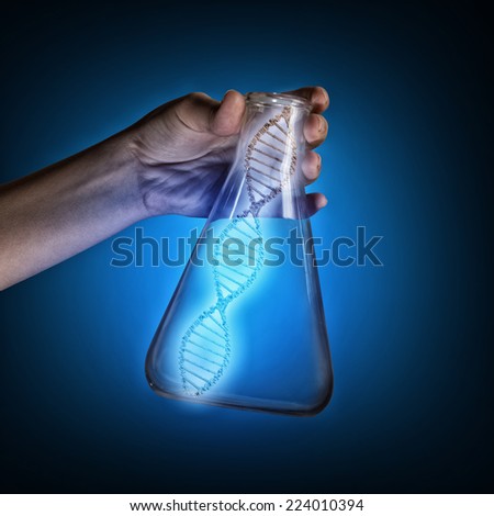 Close up of human hand holding test tube with dna