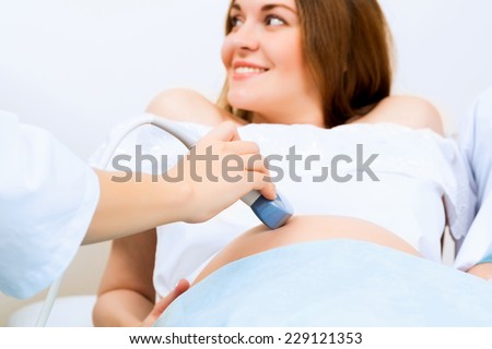 hands and abdominal ultrasound scanner for pregnant women