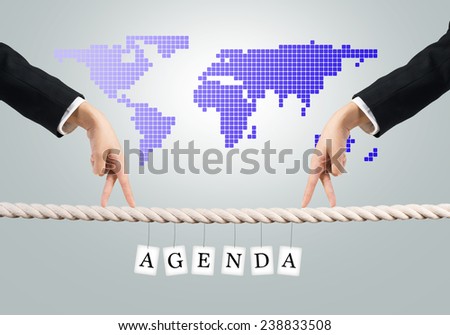 Close up of businessmen hands walking with fingers on rope