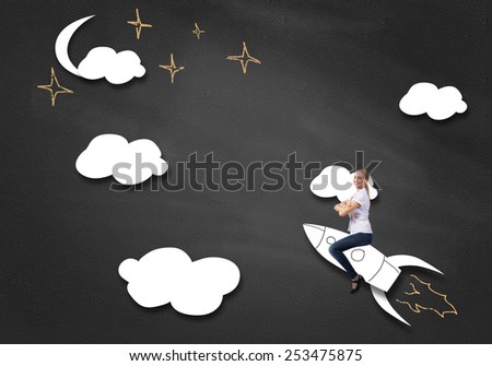 Young happy student girl riding drawing rocket