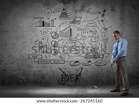Successful businessman playing golf and business sketches at background
