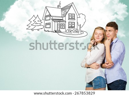 Young happy family couple dreaming of future wealthy life