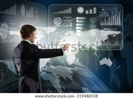 Young businessman working with modern virtual panel