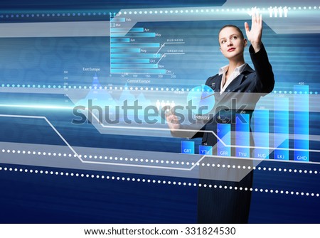 Pretty businesswoman working with virtual panel interface
