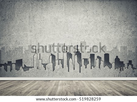 Silhouette of modern city landscape drawn on concrete wall