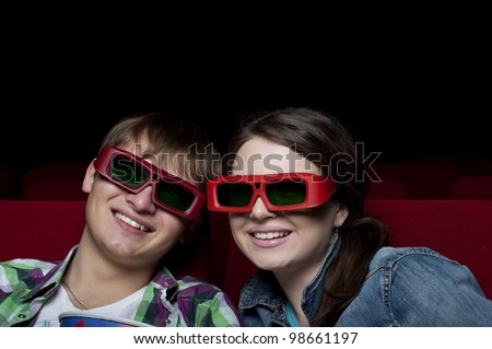 couple in a movie theater, watching a 3D movie