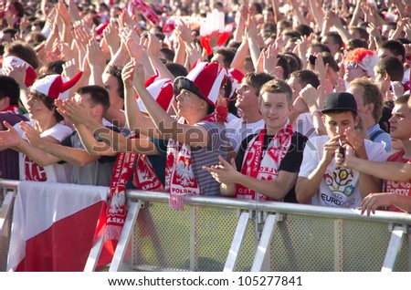 KRAKOW,POLAND-JUNE 8: Polish fans follow their team in the opening match of Eurocup 2012 against Greece in fanzone on June 8, 2012 in Krakow, Poland