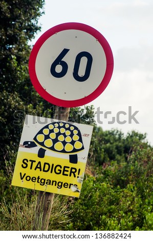 A 60 mph speed limit sign with a turtle silhouette,South Africa.