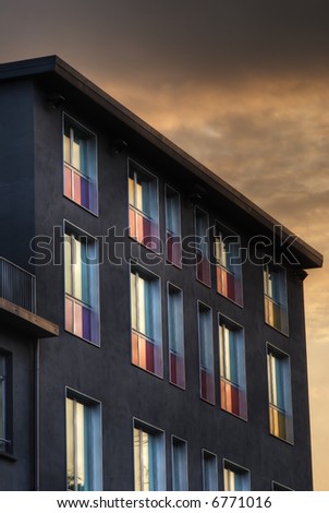 Detail of an hotel facade with colored window