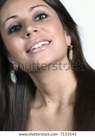 Simple portrait of a smiling beautiful girl against a white background