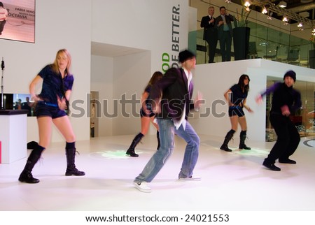 BOLOGNA, ITALY, 15 DECEMBER 2008: A group of dancers perform at the Skoda\'s display at the Bologna Motor Show 2008 in Bologna, Italy, December 15, 2008.