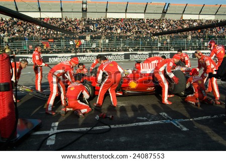 BOLOGNA,ITALY-06 DECEMBER: Ferrari racing team simulate a classic pit stop at the 2008 edition of Motor Show in Bologna,Italy