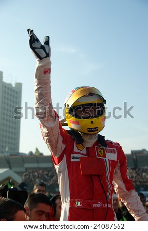 BOLOGNA,ITALY-06 DECEMBER: Luca badoer, ferraris test driver, says hello to the crowd after his performance at the 2008 edition of Motor Show in Bologna,Italy