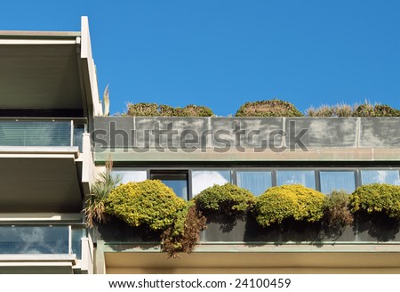 Exterior view of a Luxury Rooftop penthouse apartment terrace with green garden