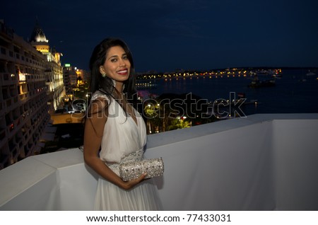 CANNES, FRANCE - MAY 17: British actress and designer  Fagun Thakrar (bag by Fagun Collection) attends the 