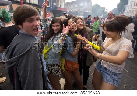 LONDON - AUG 29: unidentified youths take part in the Notting Hill Carnival on August 29, 2011 in London, England. The annual carnival,  the largest in Europe, takes place every August Bank Holiday since 1966.