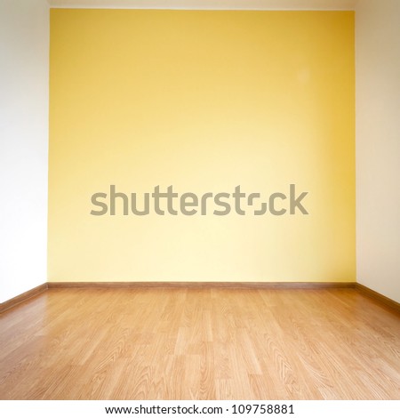 Empty Yellow Wall And Wooden Floor Room