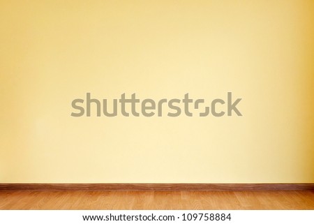 Empty Yellow Wall And Wooden Floor Room