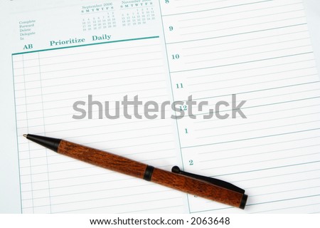 A pen laying on a day planner page