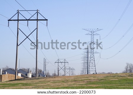High voltage power lines following a clear cut path