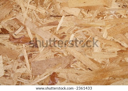 Closeup of oriented strand board OSB, construction material made of recycled wood