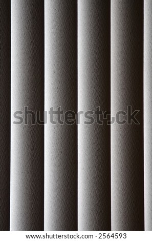 Close up of back lit sliding patio door vertical window shades for background(rough texture of blinds visible when viewed larger than thumbnail)