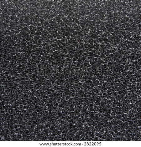 Close up of open cell foam air filter (black sponge) cellular texture