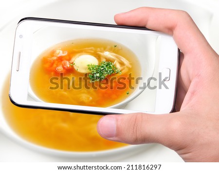 Hands taking photo soup with smartphone