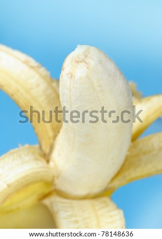 Open banana isolated on blue background