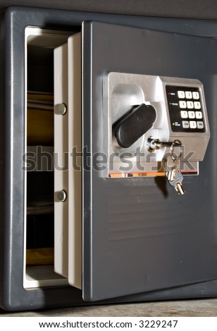 Open safe door with keys hanging on front