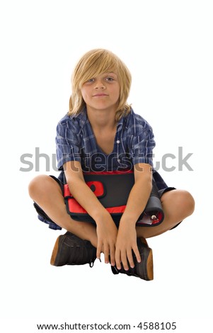 stock photo young blond preteen boy sitting crosslegged on white 