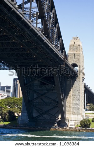 underside of sydney harbor bridge and concrete support take from harbor