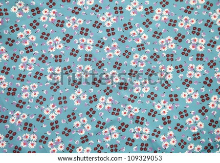 vintage cloth with flower print in blue, brown, lilac and orange