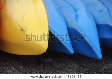 blue and yellow rental boats near a lake