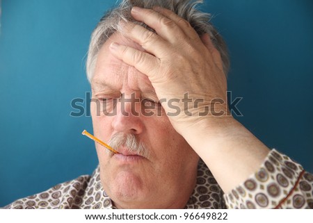 a senior man with a fever and aching head