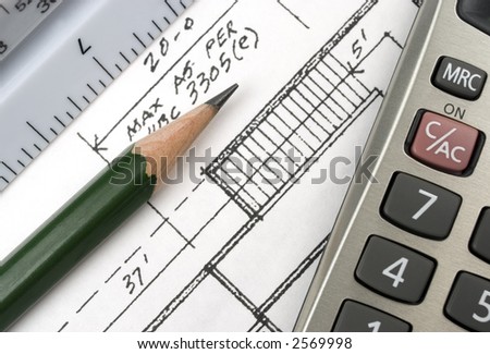 Closeup image of drafting tools on a blueprint.