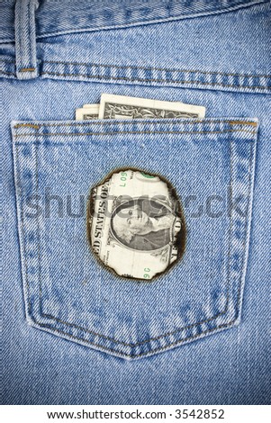 Closeup image of money burning a hole in your pocket.