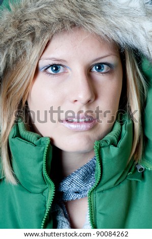 woman with a green jacket
