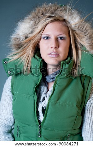 woman with a green jacket with hood