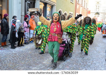 CONSTANCE, GERMANY - FEBRUARY 10 2013: Maskers in fancy dress of Narro walk in procession at the winter carnival Fastnacht in CONSTANCE, GERMANY - FEBRUARY 10 2013.