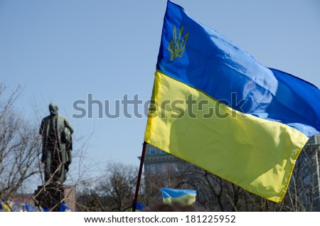 Ukrainian national flag is flying above the meeting in the Taras Shevchenko\'s public garden.