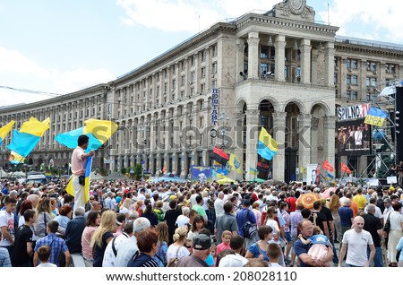 KYIV, UKRAINE - JUNE 29 2014: Thousands people take part in the political meeting against the Russian war in the East Ukraine in KYIV, UKRAINE - JUNE 29 2014.